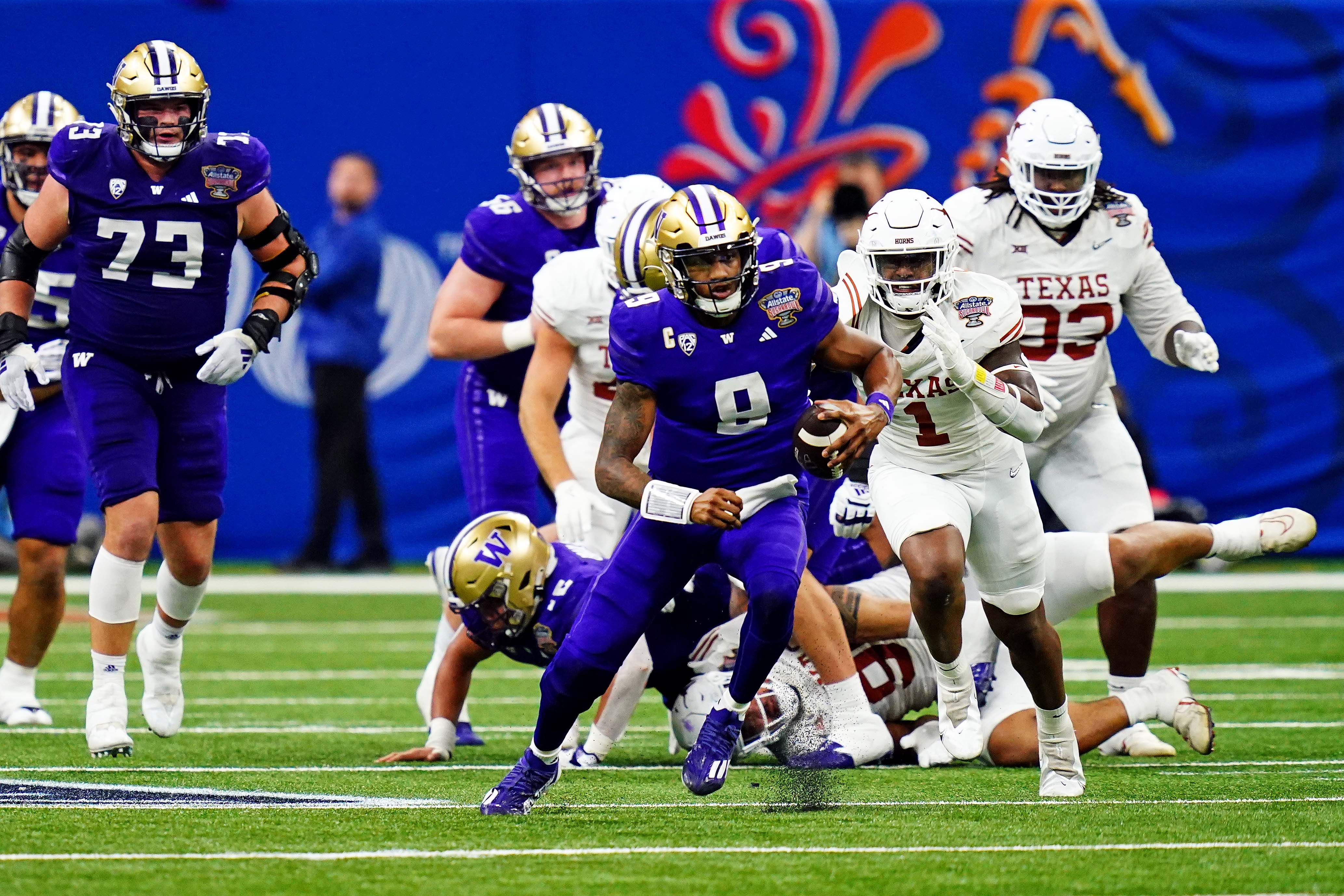 Jan 1, 2024; New Orleans, LA, USA; Washington Huskies quarterback Michael Penix Jr. (9) runs with the ball during the third quarter against the Texas Longhorns in the 2024 Sugar Bowl college football playoff semifinal game at Caesars Superdome. 